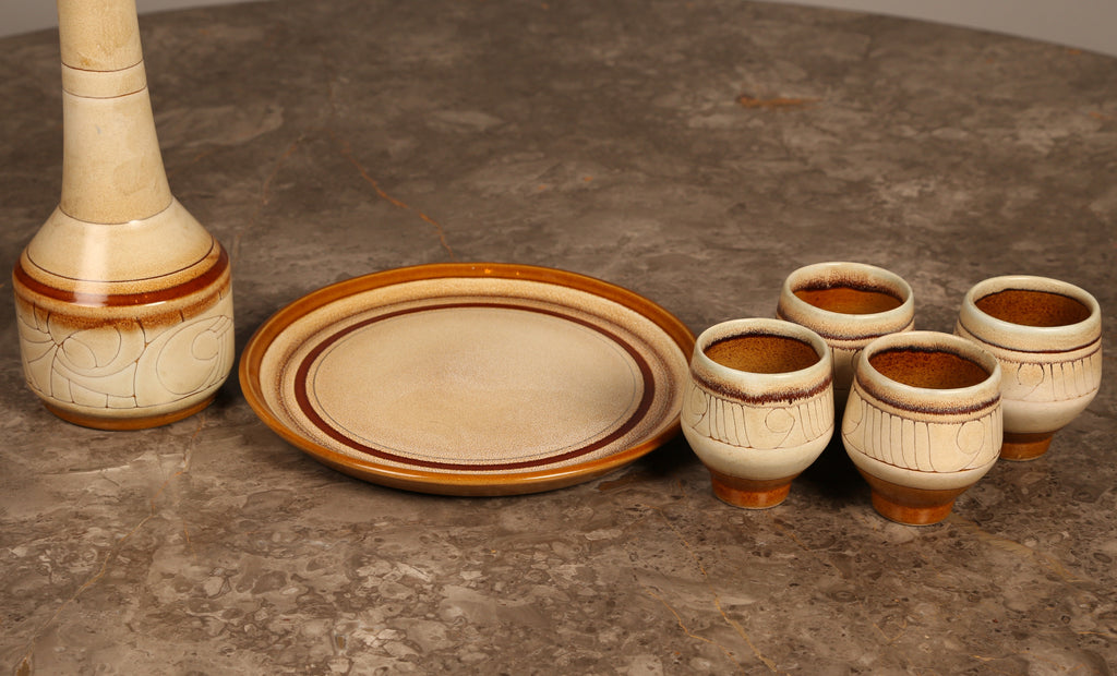 Celtic Pottery decanter with tray and 4 beakers in 'Medallion' design (1960s) Cornwall